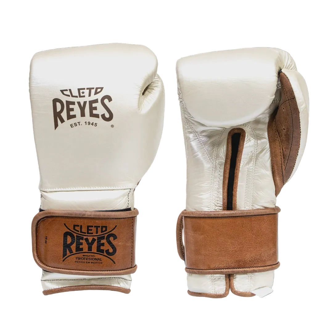 Pair of white boxing gloves with brown leather accents and 'Cleto Reyes' branding on a black background.