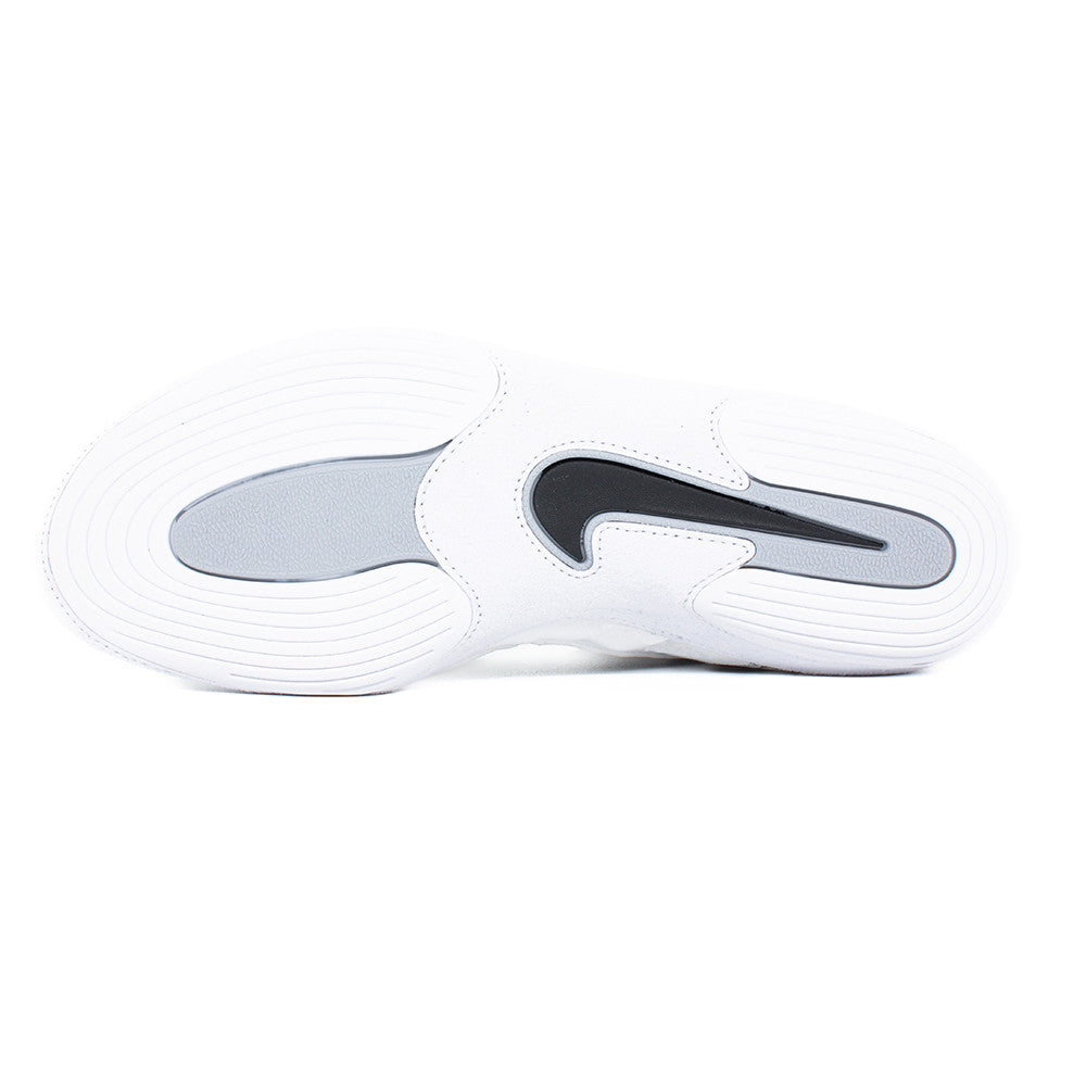 White sneaker with a gray sole on a white background