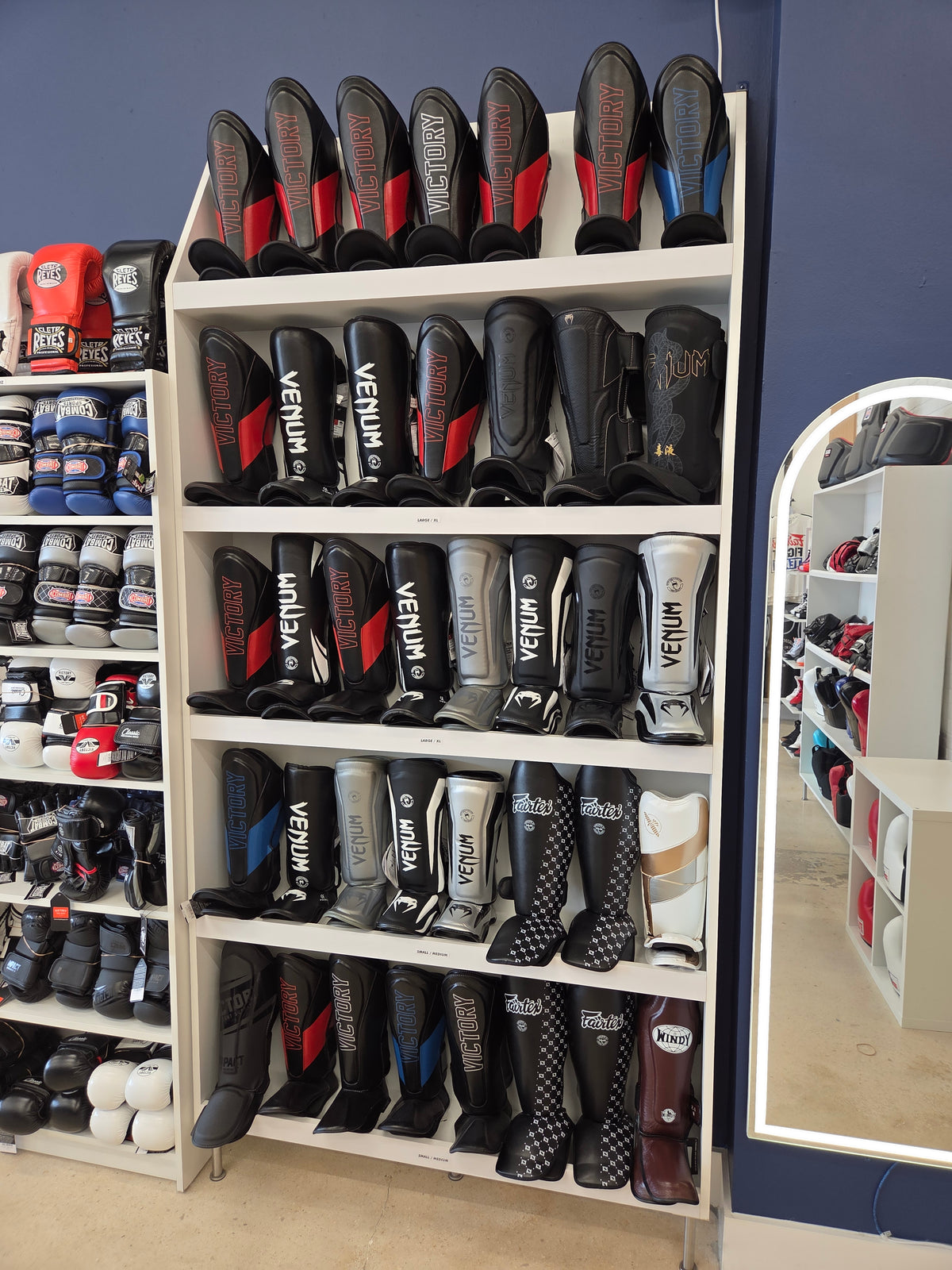 Display of Venum boxing gloves in a store setting
