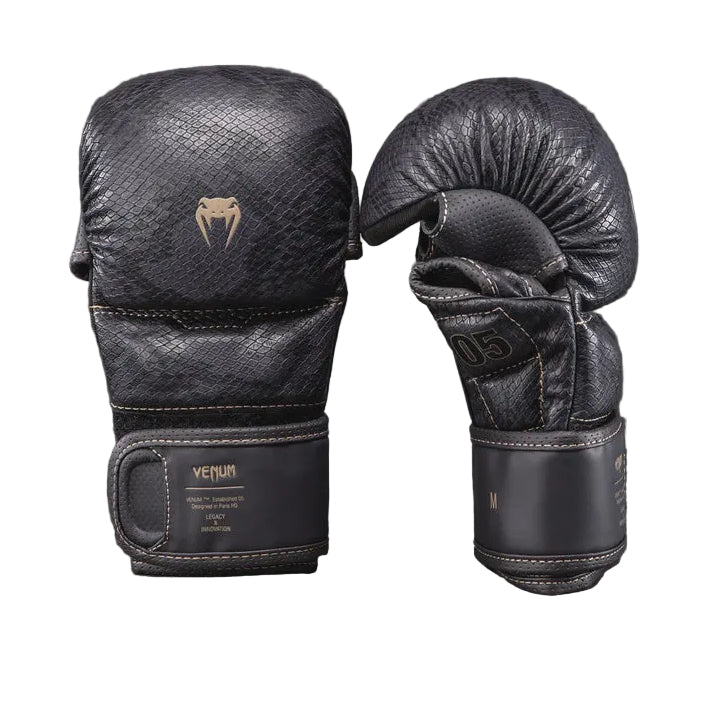 Pair of black boxing gloves with brand logo on a dark background