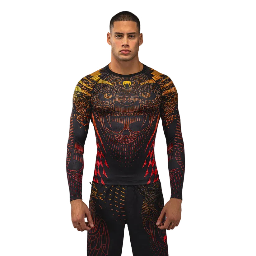 Person wearing a black and red patterned athletic outfit on a gray background