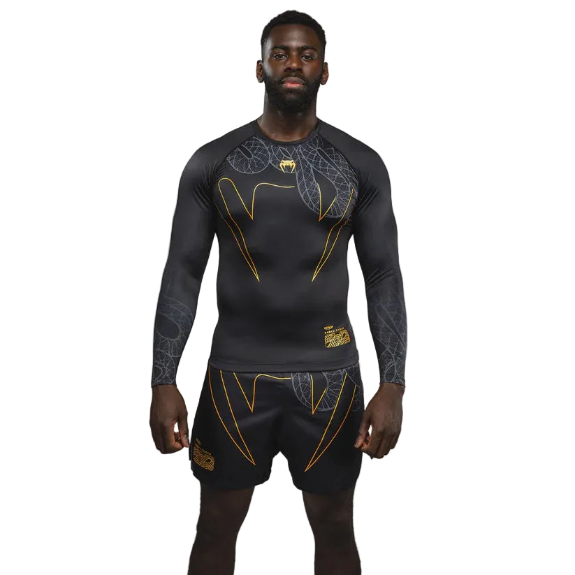 Venum black rashguard with gold serpentine accents