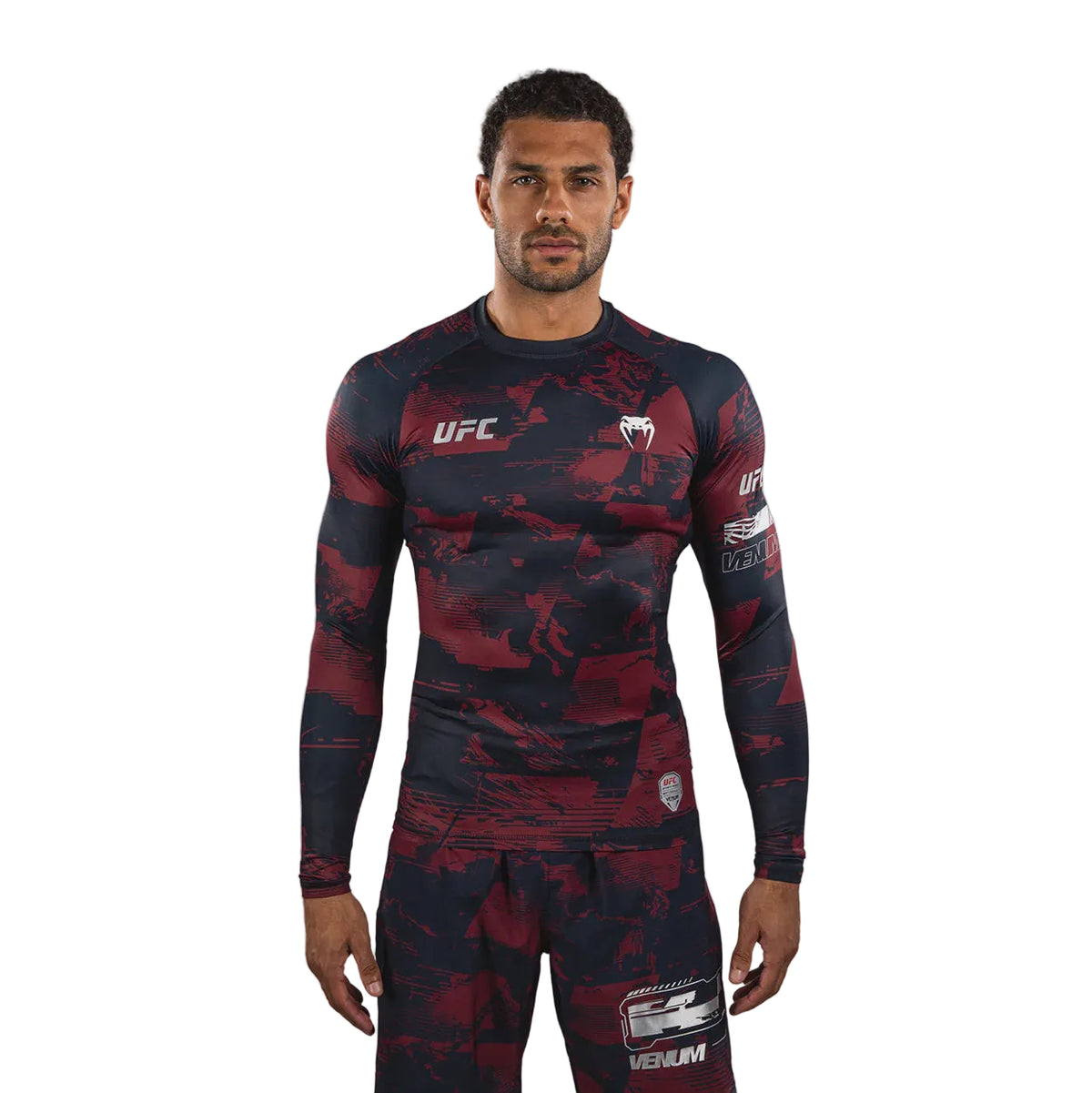 Person wearing a UFC branded athletic outfit on a gray background