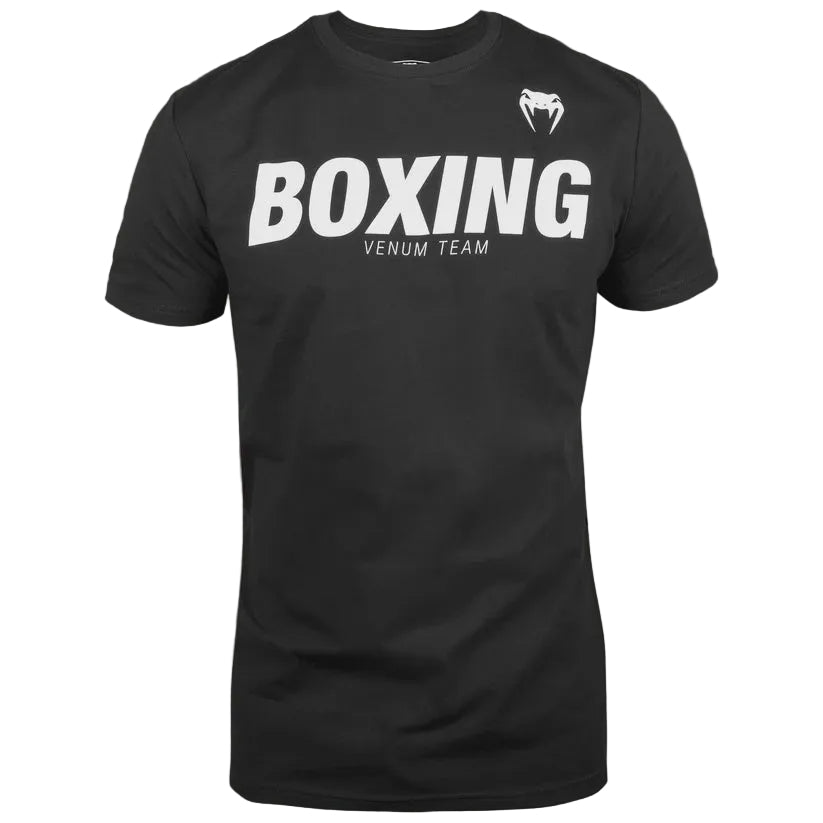 A black short-sleeve crewneck t-shirt featuring 'BOXING' printed in bold white letters across the chest, with 'VENUM TEAM' underneath and a white Venum snake head logo on the upper right chest, shown against a solid gray background.