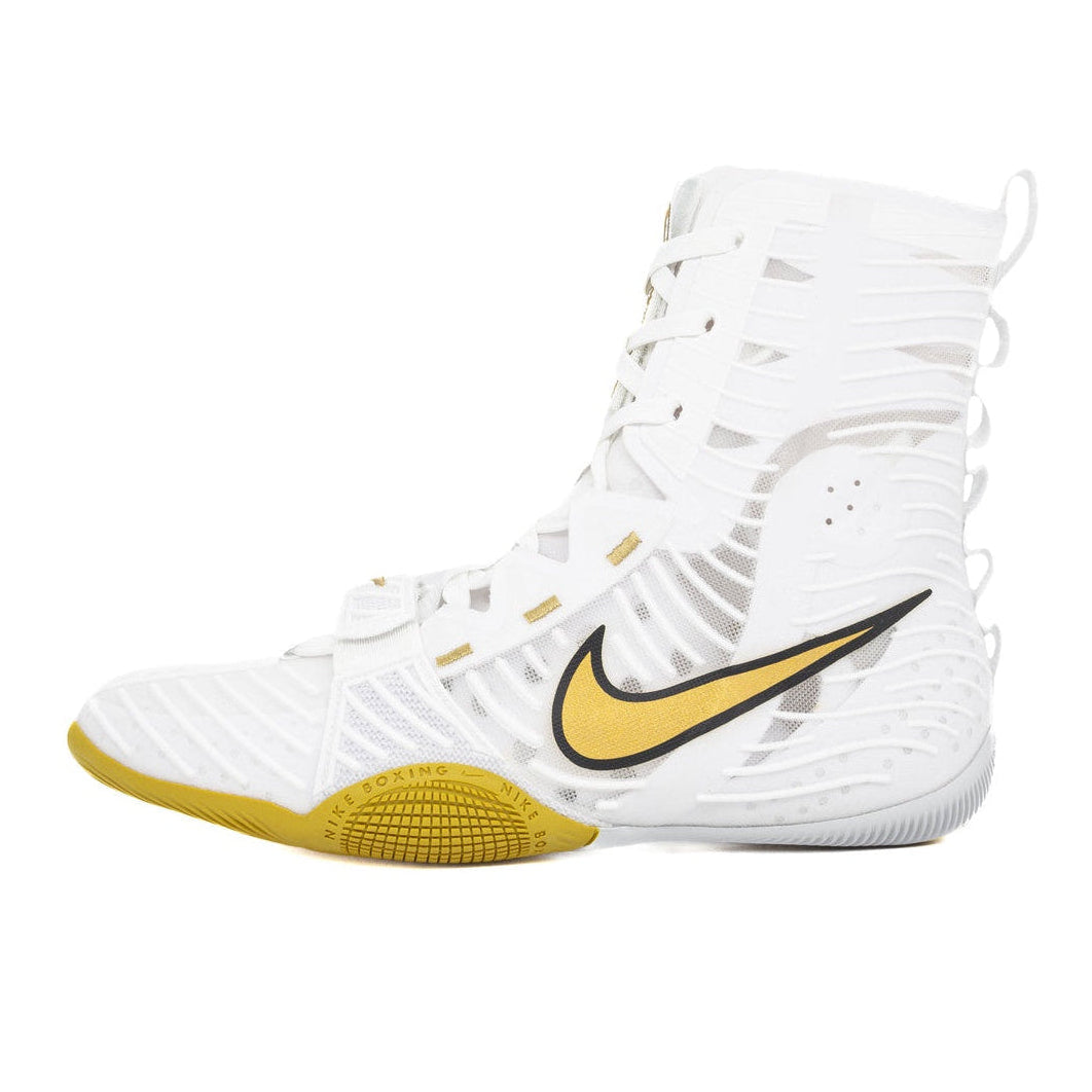 White high-top sneaker with yellow accents on a white background